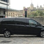 Black minibus at tower bridge